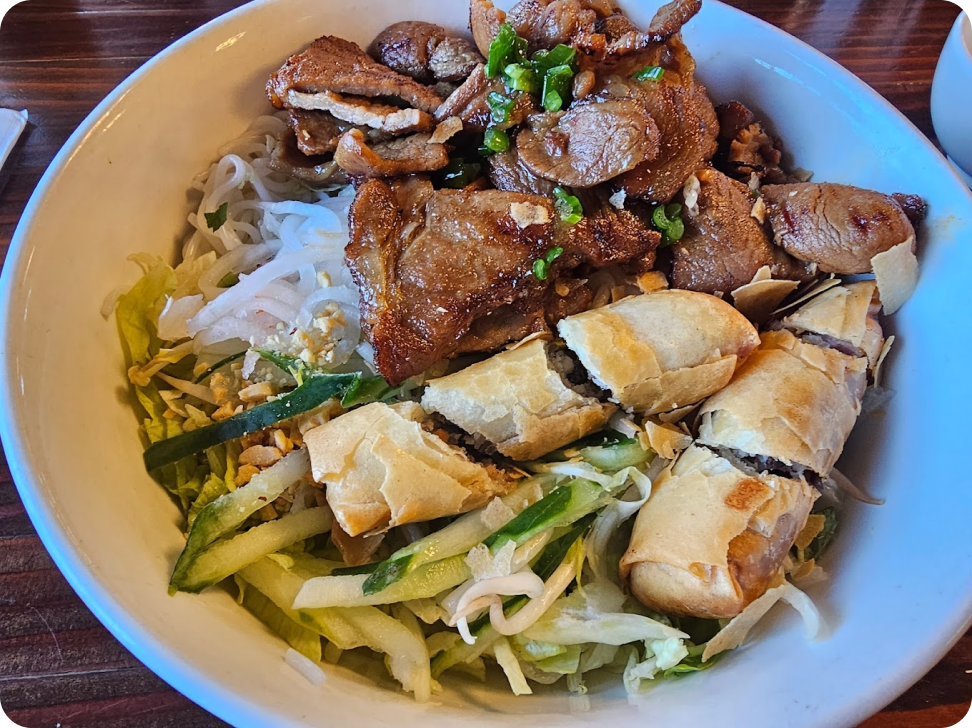 pho with spring rolls and vegetables